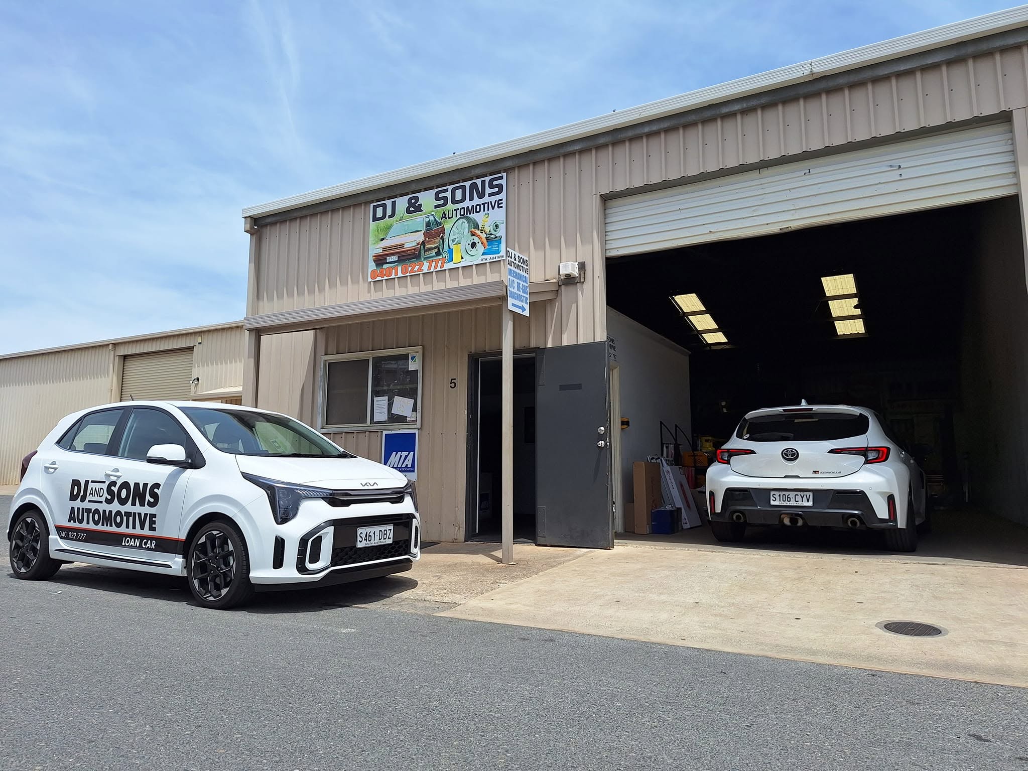 DJ and Sons Automotive workshop with a branded loan car parked outside